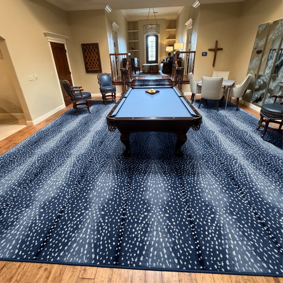Couristan's tweet photo. An Antelope print doesn't have to be neutral as seen in our Royalax II Blue Collection. This custom rug fabricated by Witt Flooring Center offers the perfect foundation for this billiards room, with its wool pile and a whole rack of blues.   https://t.co/ukDn7CUfqo  #couristan https://t.co/6LlDirKEEg