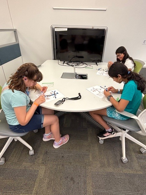 NovaEngineer's tweet photo. Deeksha Seth, PhD, assistant professor of ME, welcomed students from Walton Farms Elementary’s AI Club to campus for a hands-on engineering experience. Students explored labs, the NovaRacing car, robots and a wind tunnel demo alongside faculty, staff and student researchers. https://t.co/AmRJKFuSjI