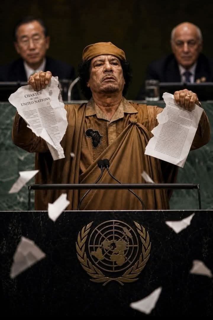 cecild84's tweet photo. A BRAVE MAN OF AFRICA DISPLAYING BRAVENESS: MUAMAH GADDAFI DEFIED THE ODDS IN A UN SITTING:
This story is not just a footnote in history; it is a scream of defiance that still echoes through the halls of the African Union and the streets of every nation that has felt the cold grip of neo-colonialism. History is not written by the brave—it is written by the victors, the powerful, and the plunderers. But on one afternoon in New York, the script was flipped.

​🛡️ SEPTEMBER 23, 2009: THE DAY THE ILLUSION SHATTERED
​Most people don’t remember this day. Most were never told the full story because the system prefers you believe in the "madness" of the messenger rather than the truth of the message.
​On September 23, 2009, Muammar Gaddafi walked onto the most guarded podium on Earth. He didn't come to beg for a seat at the table; he came to kick the table over. In a room filled with global elites, kings, and the architects of the "New World Order," he did the unthinkable: He tore the UN Charter.

​It wasn’t theater. It wasn’t a breakdown. It was a forensic dissection of a system built to manage oppression rather than end it. Behind him, the faces of institutional power—Ban Ki-moon and Ali Treki—looked on in horror as the torn pages fell like a quiet indictment: "Your rules mean nothing when the powerful write them and the weak die by them."

​⚠️ THE "COUNCIL OF TERROR"
​Gaddafi stripped the mask off the UN Security Council, calling it what few dare to whisper: A Council of Terror.
​Political Feudalism: He exposed the Veto system as a crown for five permanent kings. A minority ruling over the majority, deciding which wars are "legal," which nations are "rogue," and which sanctions will starve a generation.

​The 100-Minute Truth: They gave him 15 minutes to speak. He took over 100. Because truth doesn’t ask for permission from an empire.

​The Reparations Demand: He demanded accountability for centuries of African exploitation. He asked why colonizers preach democracy while sitting on stolen gold, and why international law only exists when it is convenient for the West.

​He spoke of manufactured conflicts, selective justice, and political assassinations. He reminded the world that "freedom" becomes a weapon when controlled by the hands of the oppressor. 
What was "unacceptable" to the elites that day wasn't the illegal wars or the proxy massacres—it was an African leader who refused to bow.

​The system does not forgive defiance. It erases it. But the exposure remains. Power does not fear weapons; it fears the man who refuses to fear.

​🏛️ THE UN CHARTER: THE ARCHITECTURE OF DISADVANTAGE
​What is the UN Charter?

The UN Charter is the foundational treaty of the United Nations, signed in 1945. It establishes the purposes, structures, and "rules of the game" for international relations. While it preaches "sovereign equality," its actual mechanical structure is a blueprint for hierarchy.

​How does it disadvantage Africa?
​The 1945 Freeze: The Charter was written in 1945 when almost all of Africa was still under colonial rule. African nations had no say in the drafting of the rules they are now forced to follow.

​The Veto Trap (Article 27): The Charter grants permanent seats and Veto power to only five nations (P5: USA, UK, France, Russia, China). No African nation has a permanent seat. This means one Western power can veto a resolution supported by all 54 African nations.

​Chapter VII Inequity: The Security Council has the power to authorize military intervention or sanctions. Historically, these powers have been used almost exclusively against Global South nations, often bypassing the AU's own peace and security frameworks.

​What voice and powers does Africa have in the UN?
​The General Assembly (The "Voice"): In the General Assembly, Africa has the largest voting bloc (54 votes). Every country has one vote. This is Africa’s "moral pulpit" where it can pass non-binding resolutions.