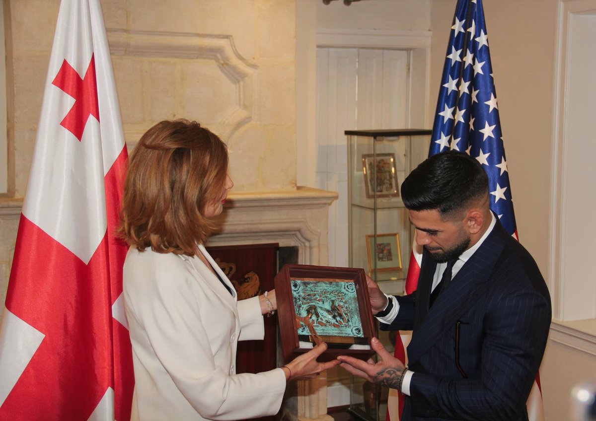 TTaliashvili's tweet photo. It was a pleasure to host @Topuriailia ✨️ at the 🇬🇪Embassy of Georgia today. After @WhiteHouse visit yesterday, it was especially meaningful to present him with an ancient Georgian, Colchian belt buckle — a symbol of our heritage, resilience, and victory. We wish him success in his upcoming fight at #UFC #Freedom250