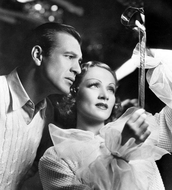 LostInFilm's tweet photo. Happy birthday, Gary Cooper! Seen here with Marlene Dietrich on the set of Frank Borzage's 'Desire' (1936) https://t.co/BfnoOsibZE