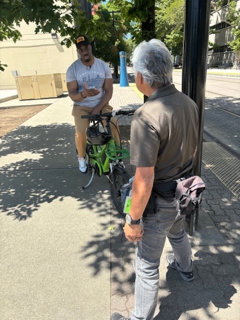 CaltransHQ's tweet photo. CA Transportation Sec. @ToksOmishakin speaks w/ @kcranews photojournalist Mike Domalaog before joining the Caltrans "May is Bike Month" leadership ride. The annual event spreads awareness about the state's investments to expand safer travel options for people who walk &amp; bike. https://t.co/5OHlYnsht8