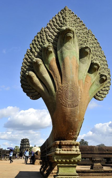 Seven-headed king Naga at the entrance of the World’s largest religious monument, Angkor Wat, built by the Hindu King Suryavarman II.