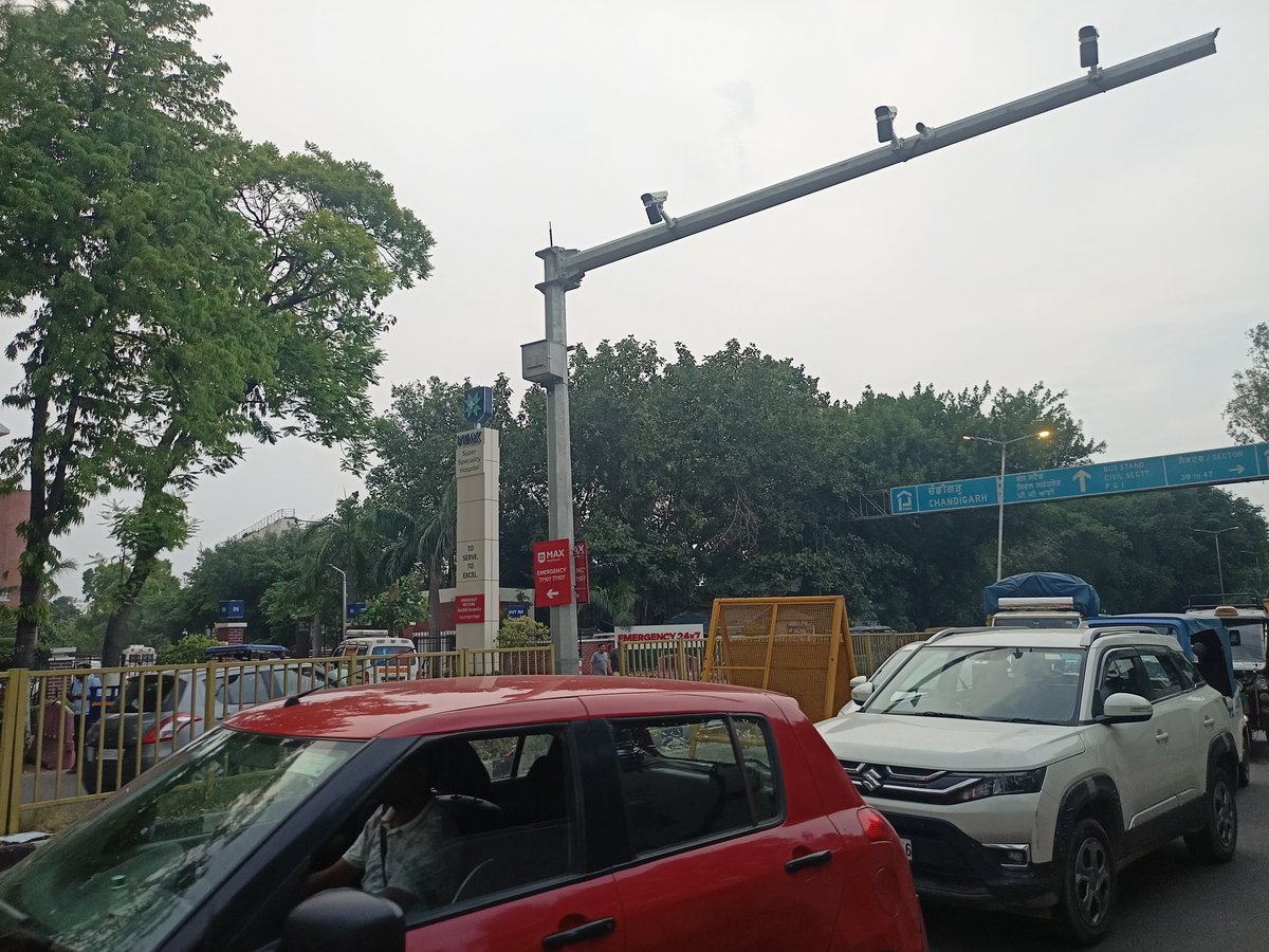 Rhyacharya's tweet photo. Been going towards Mohali’s Max Hospital for the last 2 days and what I witnessed is beyond frustrating.... Let’s put this on the table...

The so called Punjab Police naka near the Chandigarh-Mohali border has turned into a complete traffic nightmare. Around 6-7 huge barricades have been placed in zig zag fashion forcing every vehicle coming from Chandigarh towards Mohali/Kharar to crawl at snail’s pace.... Buses, ambulances, daily commuters everyone stuck for no reason while cops were busy on phone calls instead of actually checking vehicles... This isn’t just an inconvenience, this is an absolute mismanagement...

The biggest issue? A hospital sits RIGHT next to this naka... Anyone coming from Chandigarh to Max Hospital first has to survive the endless jam, then take a U-turn because the road has been blocked in such a bizarre manner... And at the U-turn point? Traffic lights not working, zero traffic police to manage movement, chaos everywhere.. 

Imagine someone rushing in an emergency... Minutes matter there... But here people are left trapped in traffic because authorities thought putting giant barriers on a road was “management”...

Even pedestrians aren’t safe... I personally struggled crossing the road from Max Hospital towards the Gurudwara opposite it because vehicles were speeding aggressively from all sides... If a healthy adult finds it difficult what about elderly patients, attendants or someone in distress?

And when questioned, the officers deployed there casually replied “Hum toh bahar se laaye gaye hain, seniors se baat karo,” while the senior officers themselves stood busy on calls in the middle of the road as commuters suffered...

Who approved such reckless planning outside a sensitive zone like a hospital? This naka looks more like a showpiece than actual policing... Authorities need to wake up... 

#Mohali #Chandigarh #Punjab #Punjabpolice @PunjabPoliceInd @DGPPunjabPolice @Gulab_kataria @BhagwantMann @sasnagarpolice @NS_Mahal @dcmohali