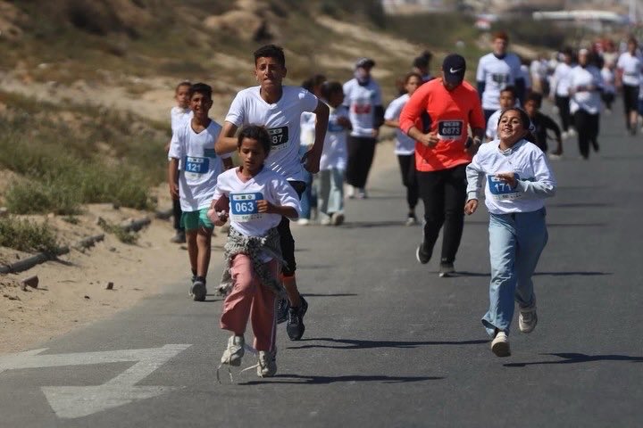 Palestinians take part in the International Palestine Marathon held along the coastal road in Gaza City, May 8, 2026. simultaneously with a marathon that took place in Bethlehem in the occupied West Bank.