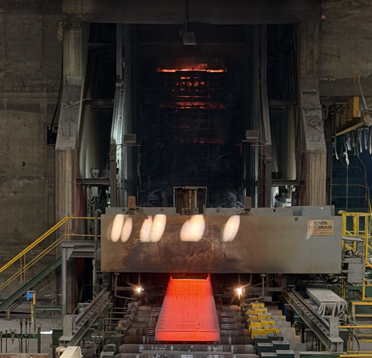CorewireLtd's tweet photo. #FridayPhoto - This photo captures the glow of the molten #steel at the top of the continuous caster all the way to the solid slab at the bottom. What a fantastic process. Roll life is a critical part of this process.

#Weldclad #RollWelding #RollStrategy https://t.co/jPSg1CCL28