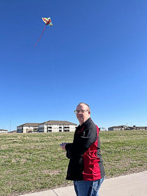 VNU_Iowa's tweet photo. A group of us recently took advantage of a few breezy days by heading to the rec trail and flying kites! That is not easy to do, but we got the hang of it and were soon entertaining passersby with colors in the sky. 🪁

 #OutdoorFun #SpringActivities #PurposePrivacyDignity https://t.co/khhoABzV4M