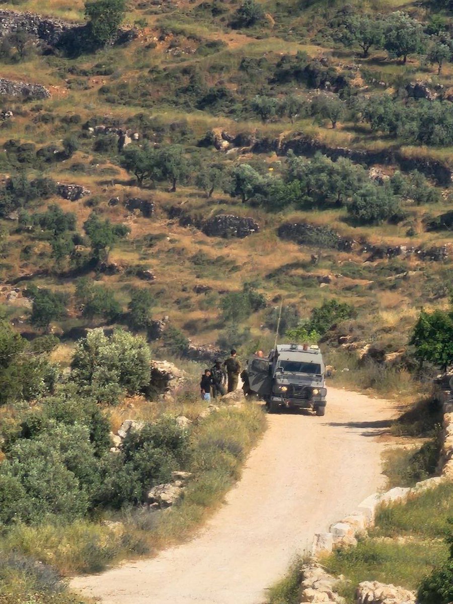 Protected by Israeli occupation forces, zionist jewish settlers attack a Palestinian farmer while he was working on his land in Beit Fajjar, south of Bethlehem.