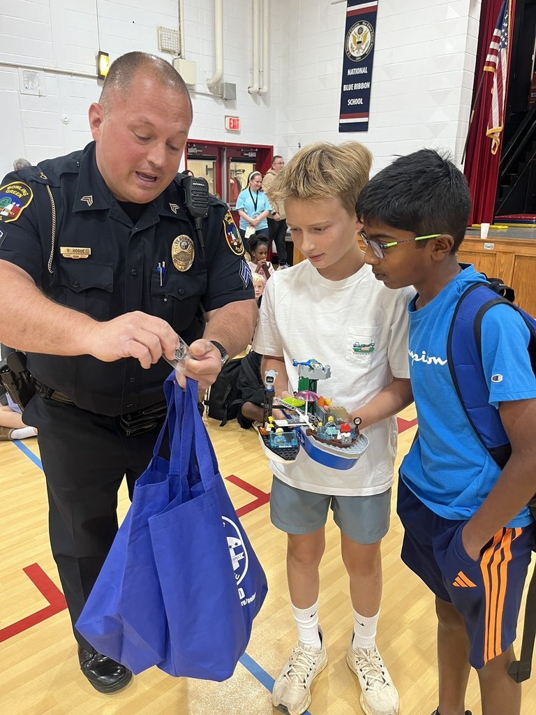 PotterGrayPride's tweet photo. Ollie and Varun designed and built a police boat in STEAM Lab with the police department’s future needs in mind. Officer Hogue surprised them with police coins given to those who help and a SWAG bag to thank them for their creative design and hard work https://t.co/sUoRDCs1wU