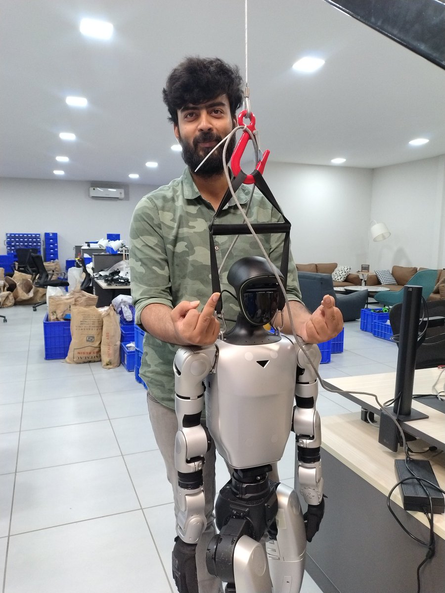 kassesopia's tweet photo. chilled around with the real humanoid bot today. you can actually drive it using a ps5 like controller. https://t.co/Z9d3cmIfof