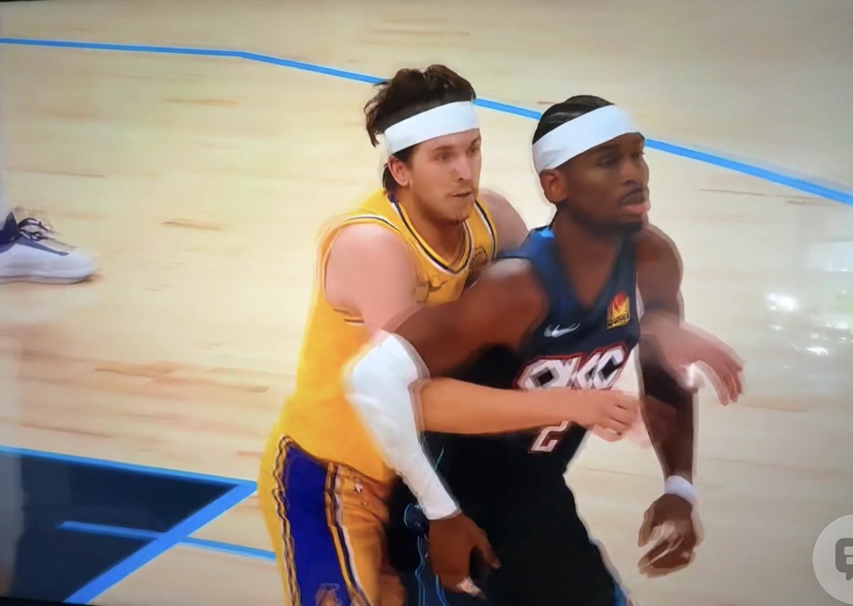BrigitAshley's tweet photo. @PurpGoldLakers 😂 try looking from the other angle. Reeves literally puts his arms under Sga’s. Then flails his arm out while Sga tries to position. 

On a fast break Reeves ripped Sga down with his arm also injuring LeBron. It’s basketball people. https://t.co/0u2mLYpZOT