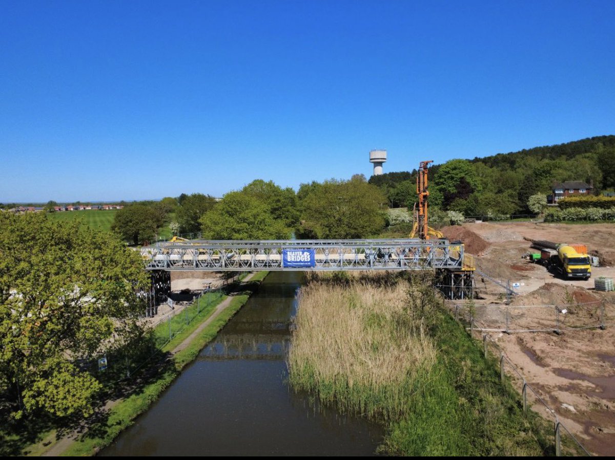 BridgesBeaver's tweet photo. Innovative engineering at Daresbury.

We successfully completed the installation of a 34m modular panel bridge at Daresbury for our client, Redrow, marking a critical milestone in their site development programme.

In a UK first, our team repurposed and utilised screw piles to found the structure, with stems rising more than 5m above ground level. This strategic decision eliminated the need for additional trestling, significantly streamlining the temporary build.

Project Highlights:

🚧  Capacity: Engineered to carry 70-tonne piling rigs over a Peel Ports Canal.

👷  Scope: We acted as Principal Contractor within our own CDM area.

🚚  Full Delivery: Following the bridge installation, we are now completing the sheet-piled retaining structure and stone access ramp.

By integrating specialist lifting, bespoke fabrication, and ground engineering, we are proud to have provided a seamless, heavy-duty link that keeps the Daresbury project moving at pace.

"Those who say it cannot be done, should not interrupt those doing it.’