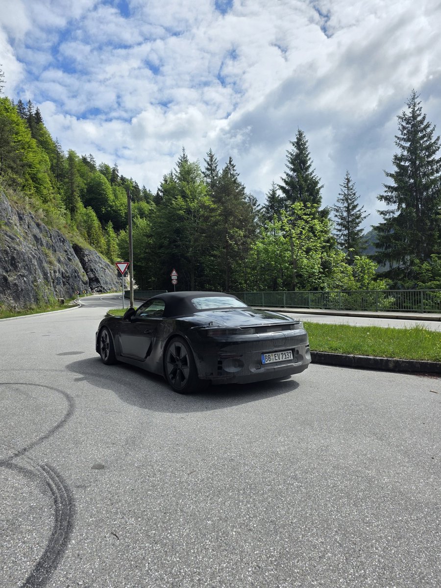 Tim_Stevens's tweet photo. Spotted in the German countryside, it's a Porsche 718 prototype with no signs of combustion. No exhaust. No engine noise. After all the chatter of the EV being canceled, I'll take this as an encouraging sign that the project is continuing.  #porsche https://t.co/L0ZvSpKYnP