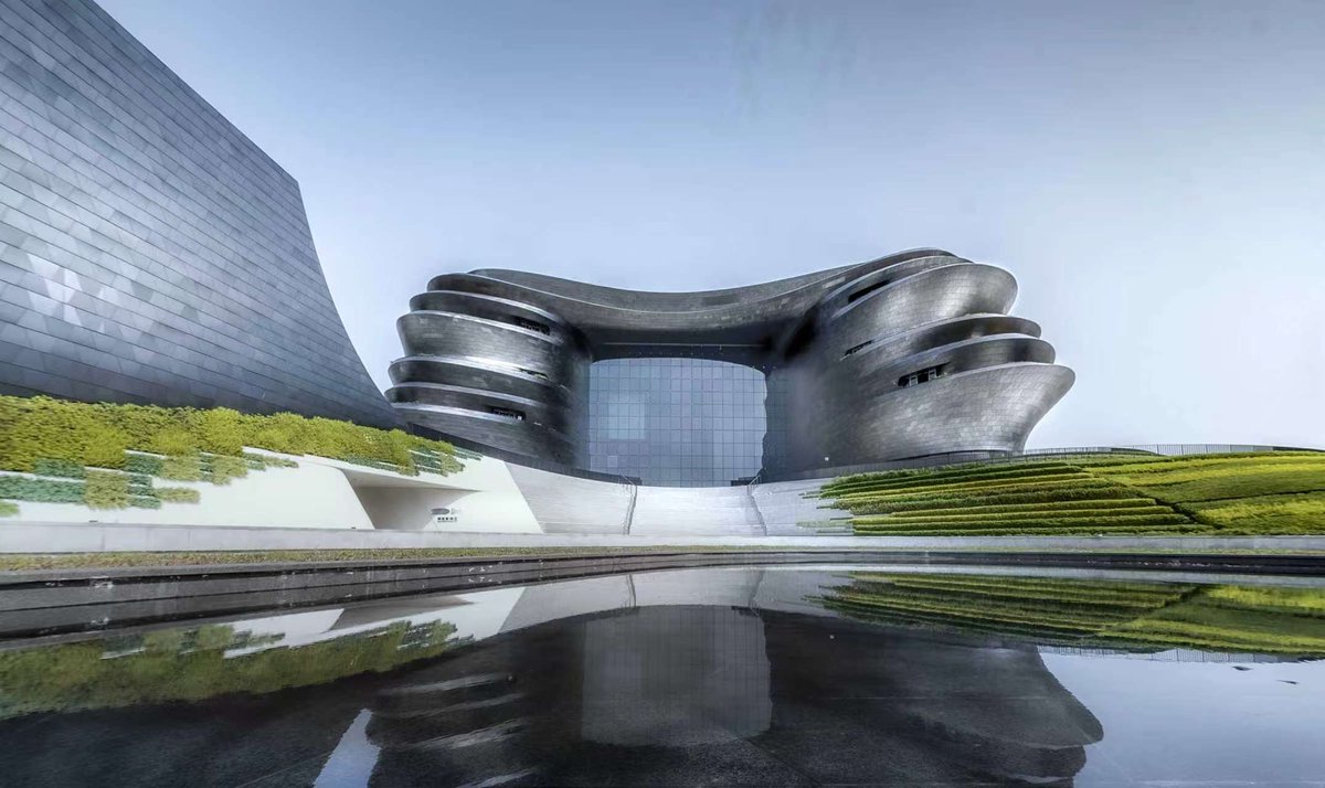 ethosmark1's tweet photo. Marvel at the futuristic exterior and explore interactive tech exhibits within. #ICIF2026 #ModernArchitecture #HighTechExperience https://t.co/CgltSHwJLl