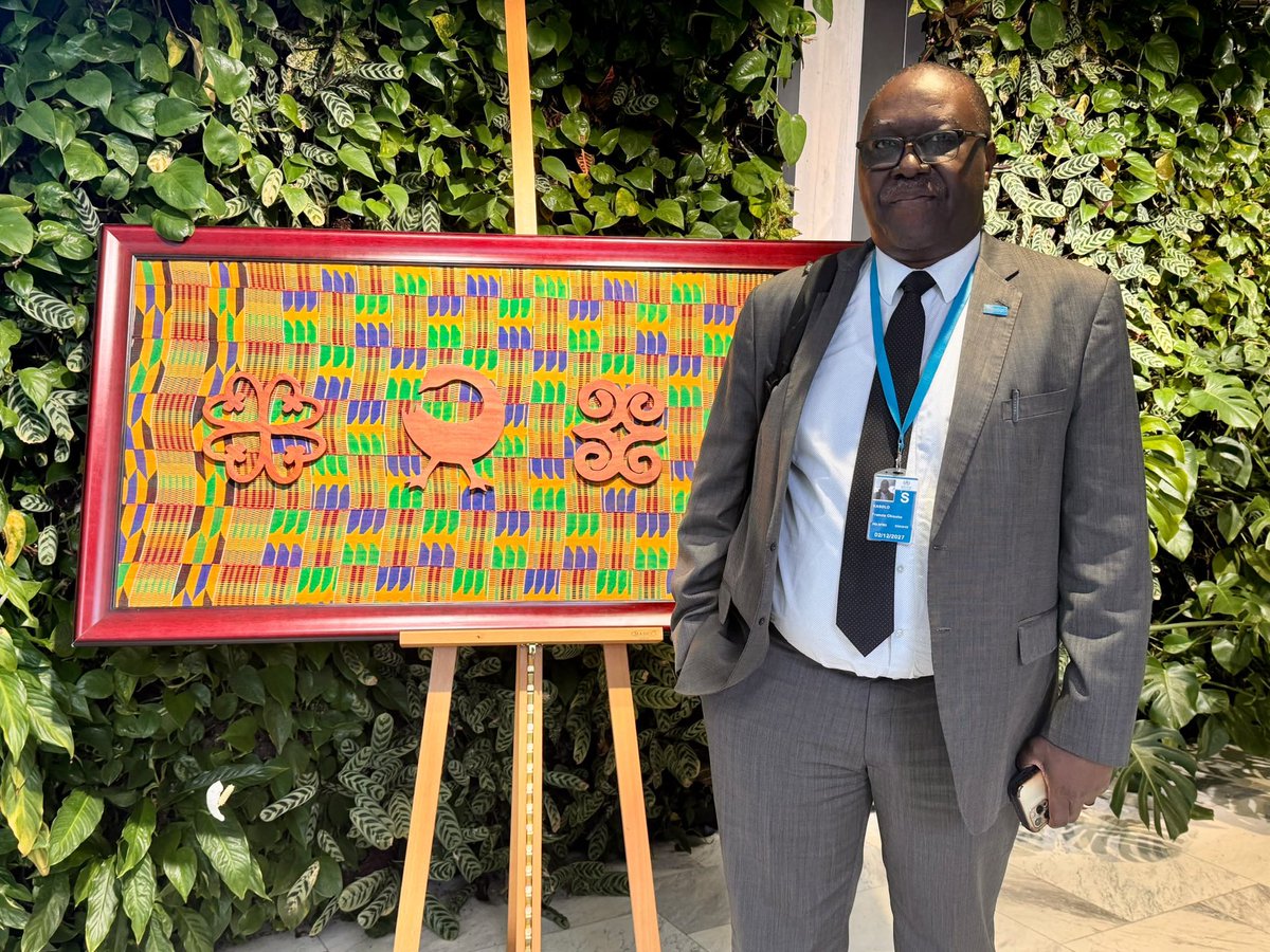 KasoloFrancis's tweet photo. Earlier this week at #WHA79, H.E. President @JDMahama of Ghana gifted @WHO an artifact with Ghana’s famous Adinkra symbols and Kente cloth. 

I’m honored to stand before it today. It serves as a reminder of Member States’ solidarity with WHO &amp; global health. @WHOEthiopia https://t.co/eiLcCcl2iD