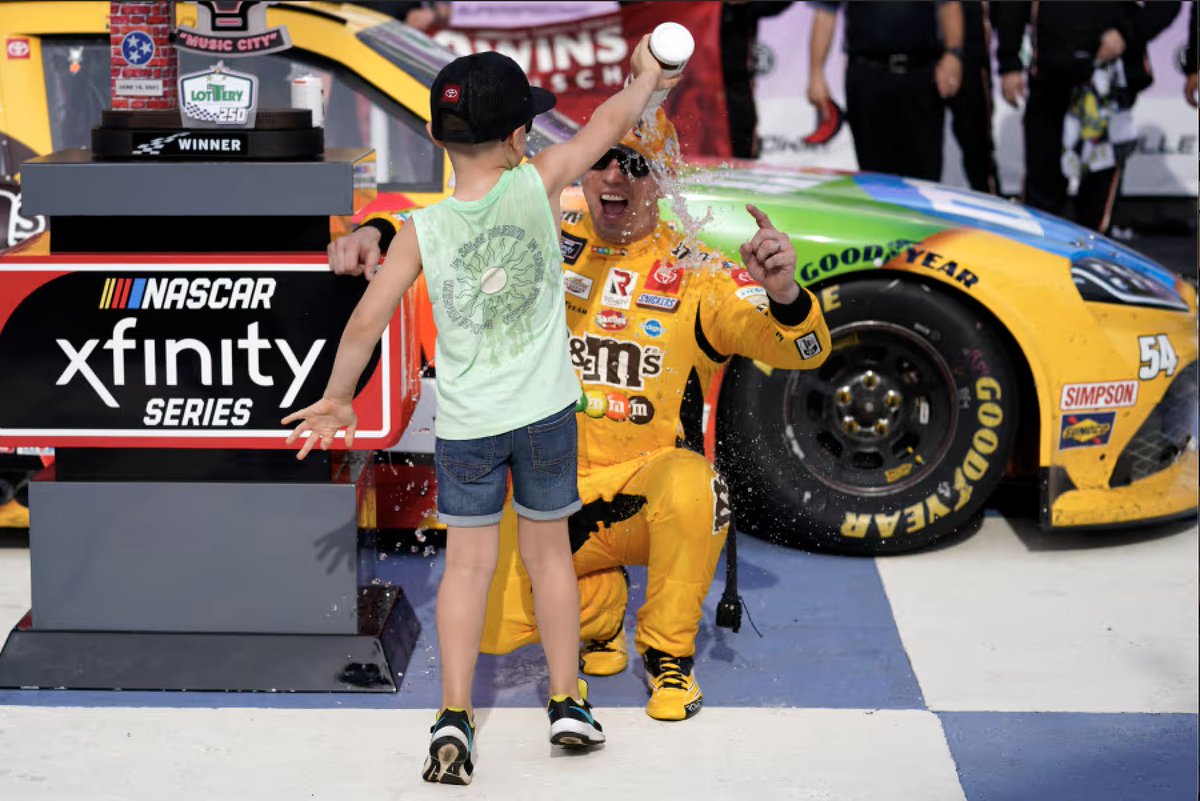 XfinityRacing's tweet photo. A number we knew only Kyle Busch could reach.

His 100th @NASCAROReillyAP 🏁 showed why he was the best to ever do it there &amp; his personality &amp; his love for his family was on full display in Victory Lane that day.

He ran 5 races in that series in 2021, he won them all. https://t.co/TP4cp1gC8T