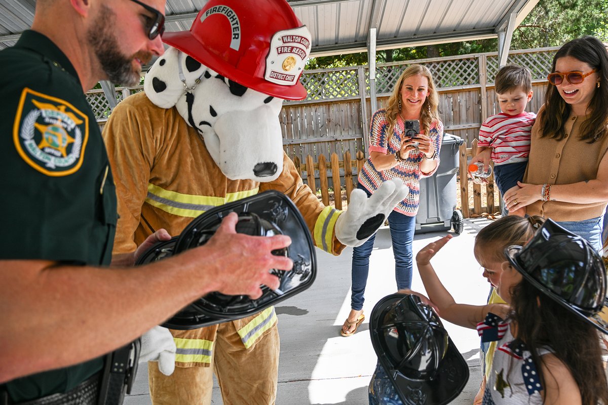 WCFRFL's tweet photo. Late yesterday afternoon, Walton County Fire Rescue crews responded to a call reporting excessive cuteness just south of Freeport.

When firefighters arrived on scene, they deployed Marshal the Fire Dog to sniff out the suspects. Marshal found several kiddos gathered behind a picket fence with maximum excitement and absolutely zero concern for personal space.

Fortunately, WCFR crews were prepared with junior firefighter helmets and even let the little ones climb inside the engine for a closer look.

Unfortunately, crews were unable to contain the cuteness.

After firefighters conducted a secondary search of the in-home daycare, crews concluded the cuteness was mobile and followed the suspects everywhere they go.