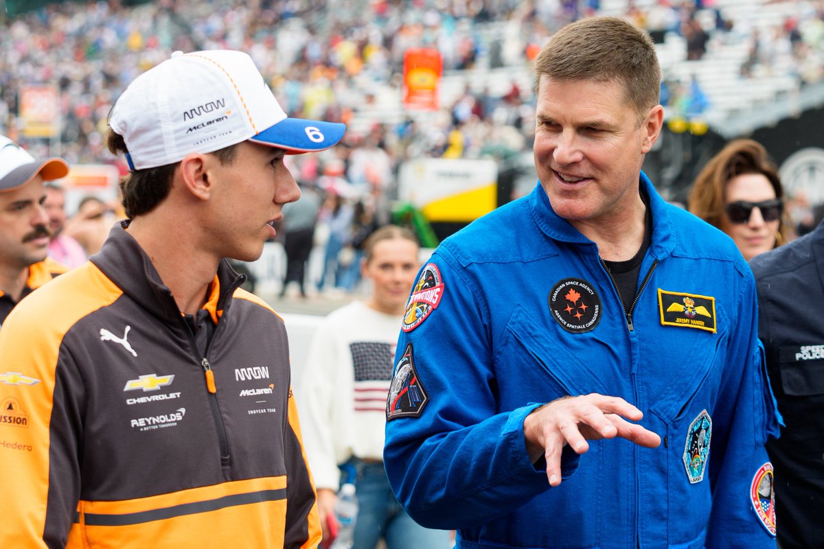 MichaelClubb4's tweet photo. Artemis II astronaut Jeremy Hansen, center, walks the track with Arrow McLaren driver Nolan Siegel, left, on Carb Day ahead of the 110th running of the Indianapolis 500. @indystar https://t.co/SpsliOrxxE