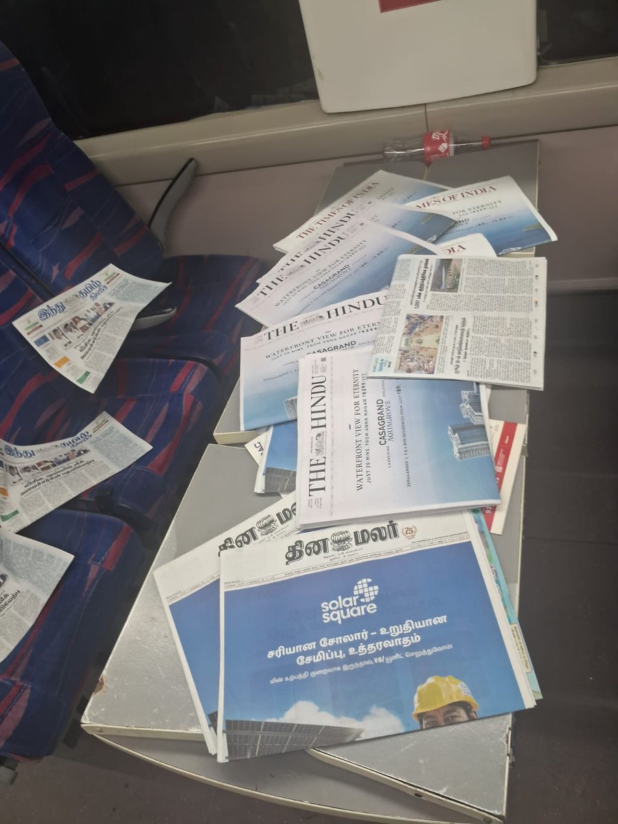 707Stewart's tweet photo. What is the need for dumping newspapers like this in Vande Bharat 20607? A few copies could be kept in a common space for passengers who read to pick up. This is an utter waste of public money, and it's scattered all over for us to clean. @RailMinIndia @RailwaySeva @IRCTCofficial https://t.co/NPqPGNrrX1