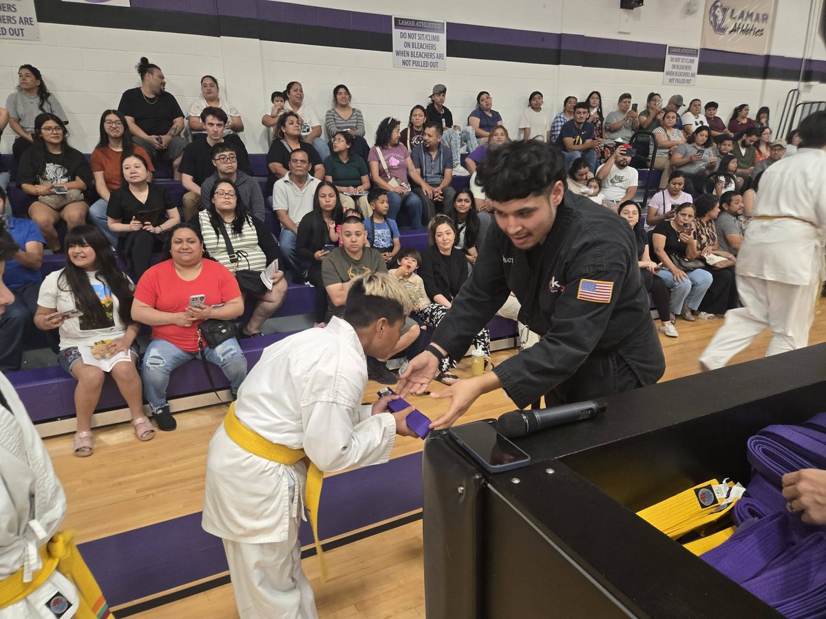 KICKSTART_KIDS's tweet photo. The journey continues! 🥋✨ Lamar Middle School students celebrated new belt ranks and inspiring testimonials at an incredible Belt Ceremony night. Congrats students, and great work Mr. Romero! #MakeADifference #Nonprofit #NonprofitOrganization #ChuckNorris https://t.co/zMNxqIZMqe