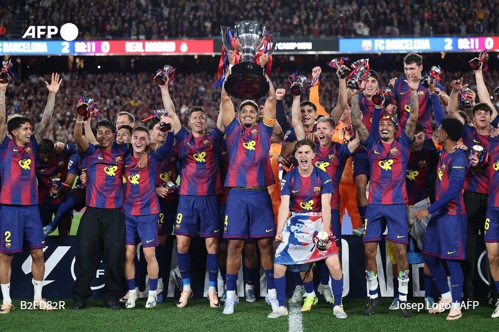 AFP's tweet photo. ⚽ 🇪🇸 Barcelona secured their 29th Spanish league title after beating Real Madrid 2-0 in the Clasico on Sunday, Hansi Flick's side clinching La Liga in consecutive years ➡️ https://t.co/yOvgGBpKDr https://t.co/BBlNT9p1KJ