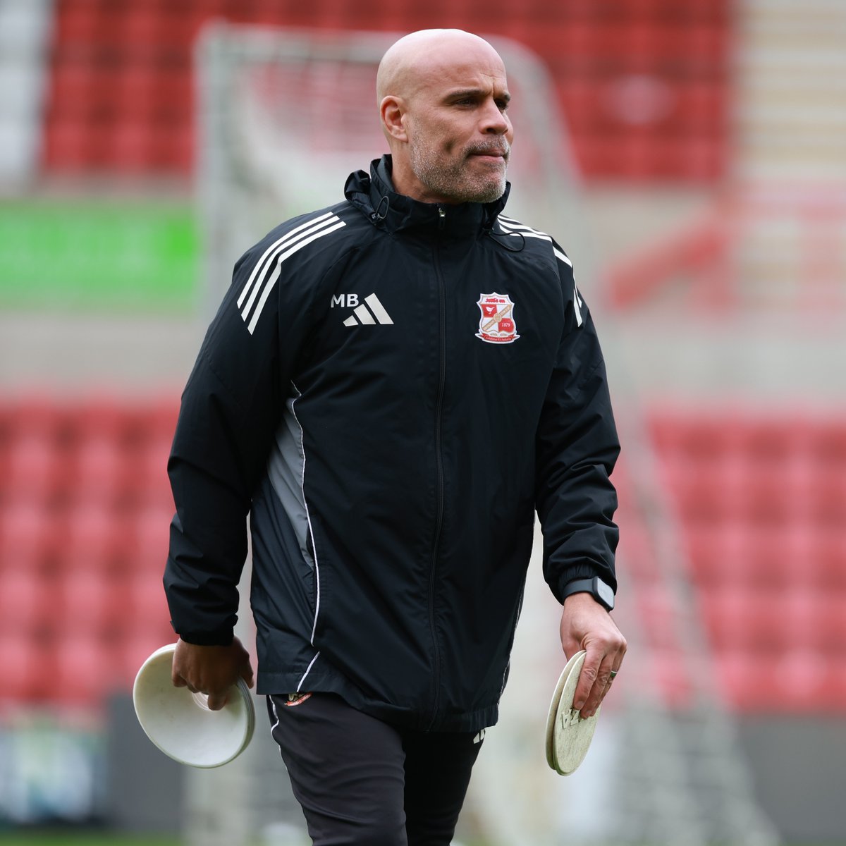 Official_STFC's tweet photo. Swindon Town can confirm that Assistant Manager, Marcus Bignot, has left the club by mutual agreement.