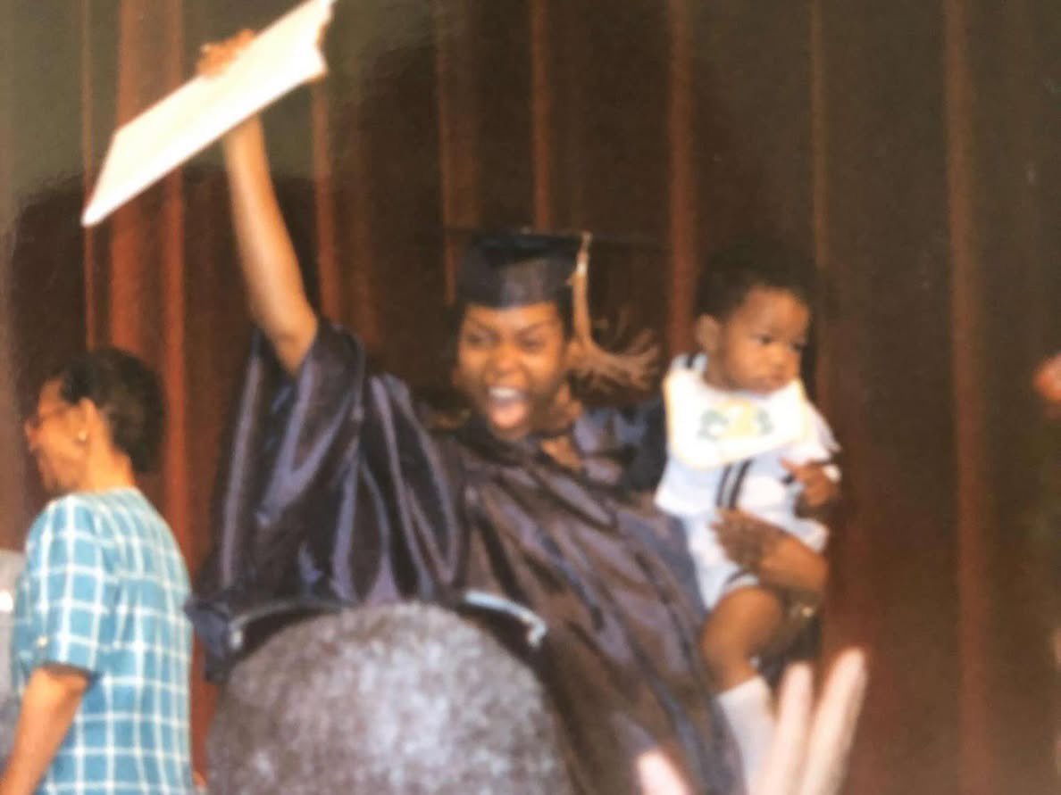 Taraji P. Henson at her Howard University graduation holding her son, Marcell (1995)