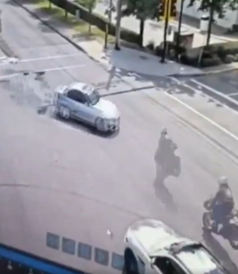 Footage shows how a motorcycle reached a hanging position on a traffic ...