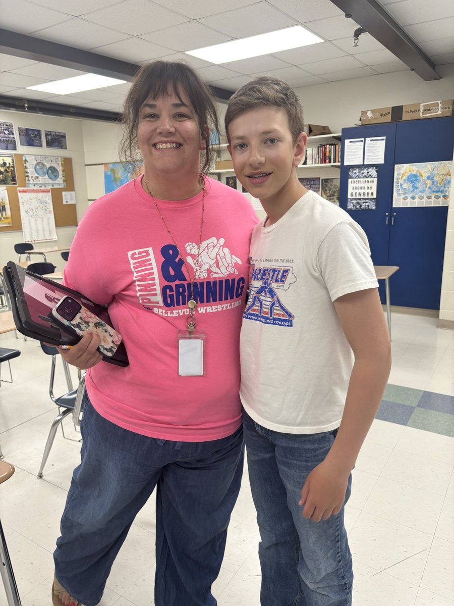 Comet_Wrestling's tweet photo. Jackie with a pin incentive shirt and Evan wearing a @IAwrestle shirt (the do a fantastic job of promoting wrestling in Iowa). #WrestlingShirtADayInMay https://t.co/vaq21IJakS