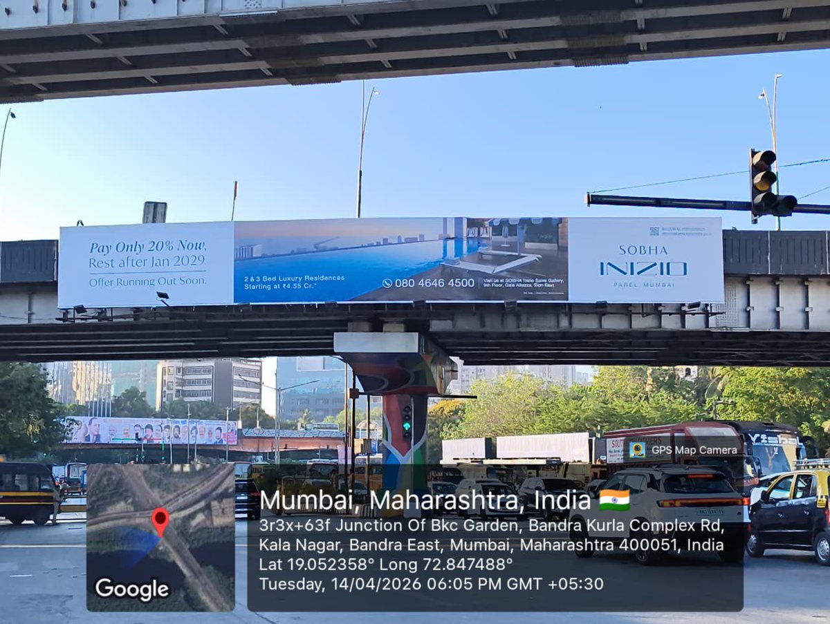 bpkalia's tweet photo. “Times of India report dated 11/05/2026 has raised serious concerns regarding uncontrolled advertisement policies, light pollution and public safety. Authorities must act before another tragedy like the Ghatkopar hoarding collapse shocks Mumbai again.

The two massive hoardings installed on the FOB/bridge structure at BKC Kala Nagar Junction, Bandra East, Mumbai 400051, as visible in the GPS-tagged images, appear to raise serious questions regarding structural safety, permissions, traffic distraction and compliance with railway/MMRDA/BMC norms.

I urge @mybmc @MMRDAOfficial @MumbaiPolice @MTPHereToHelp @CMOMaharashtra @mybmcWardHE @richapintoi and @Zoho @ZohoERP concerned departments to immediately inspect and remove these alleged illegal hoardings if found unauthorized, and register appropriate legal action against all responsible persons, agencies and beneficiary companies involved in permitting or displaying such risky structures over public roads before any major accident occurs.”