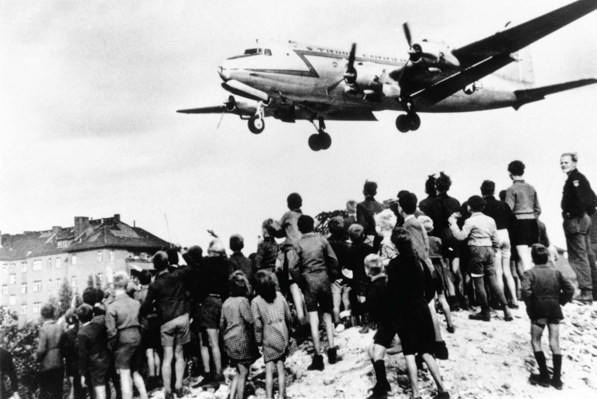 AerospaceUtah's tweet photo. As we mark the 250th anniversary of the Revolutionary War, we’re highlighting a local figure whose legacy reached around the world—Gail Halvorsen. During the Berlin Airlift, Halvorsen began dropping candy to children in West Berlin after seeing them share a single piece of gum. https://t.co/NhImJN7CzK