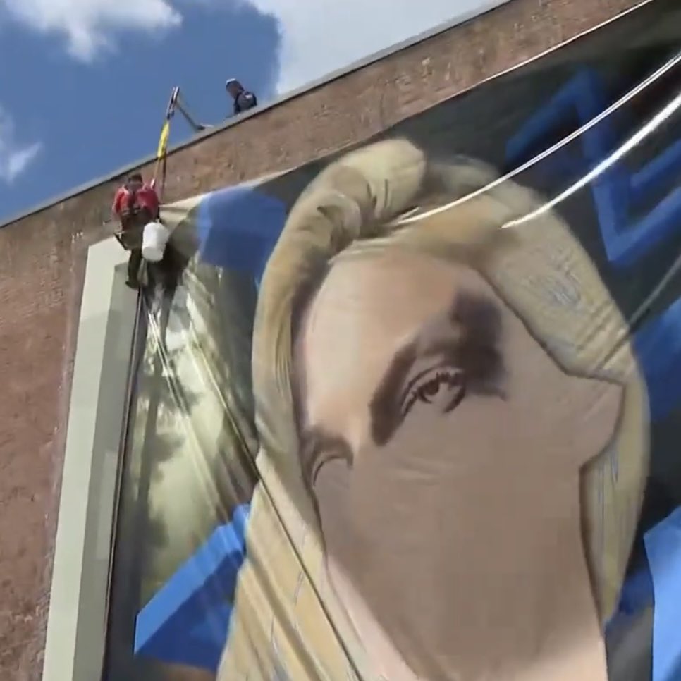 Bubblebathgirl's tweet photo. Remember Iryna Zarutska? Her mural in Rhode Island has now been torn down following protests by Mayor Brett Smiley and leftists.

Iryna was a beautiful, kind immigrant from Ukraine. She will always be remembered in our hearts no matter what murals of her get removed.

If anything, taking down these murals will only empower her memory more. Iryna has become a symbol of hope and life for all Americans and immigrants.

She will be remembered, she will be honored, and her memory will last forever.

(Video: AI tribute)