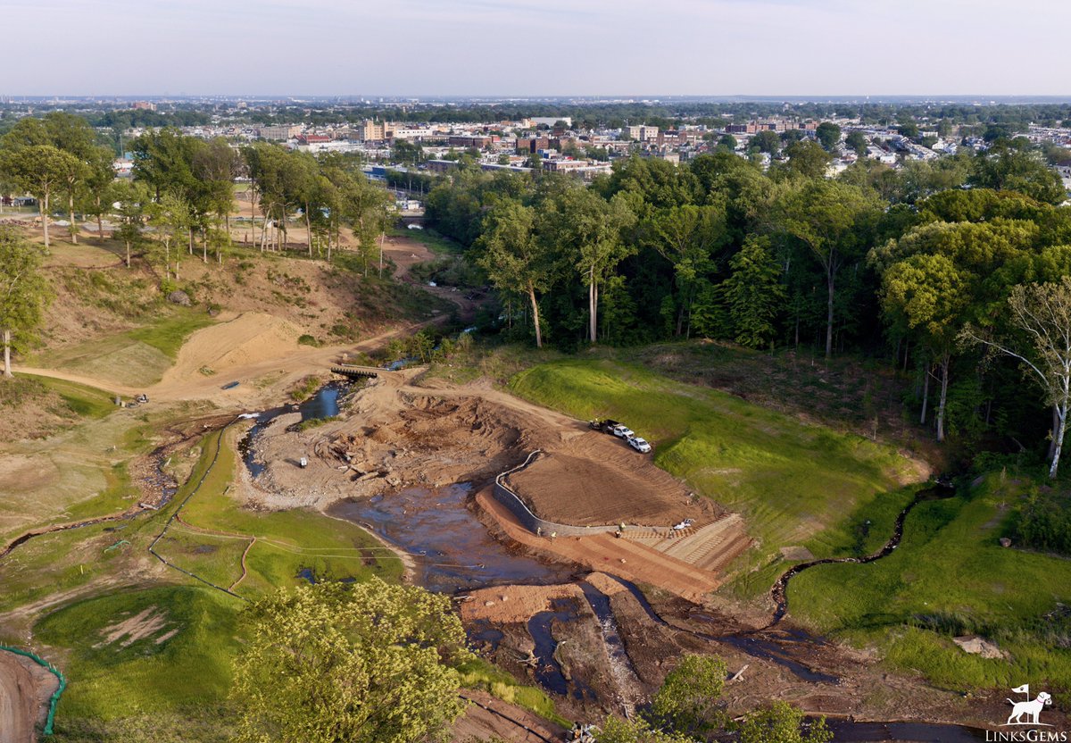 LinksGems's tweet photo. Less than 10 miles from this week’s PGA Championship is the most exciting renovation project in the world of golf:

Cobbs Creek Golf Course, among the most historic public golf facilities in the country, is nearing the final stages of its enormous renovation project under Gil
Hanse and Jim Wagner.

The completed golf complex will be nothing short of remarkable.

The Lincoln Financial Center, consisting of a double-decker driving range, a 9-hole Q School short course by TGR Design, a heritage center, restaurant, bar and lounge are already up and running.

But the jewel, of course, is the restoration and renovation of the historic 18-hole Olde Course designed by Hugh Wilson with help from George Crump and William Flynn. In its heyday a century ago, this course was a true gem, but sadly, the intervening years were not kind. To say the course was neglected is to understate things considerably.

Enter the Cobbs Creek Foundation, consisting primarily of Philly golf lovers, and the Hanse/Wagner team. The land has been cleared and prepped, the famed creek has been rehabbed, fairways have been staked and greens are being shaped. Even now, while under construction and without grass, it’s overwhelmingly obvious that the finished course will be immediately revered.

When I first started playing golf, on sunny spring days, I’d often decide spur of the moment to cut class and stop at Cobbs for a round on my way to St. Joes. Back then, the course suited my game well in that both were absolute disaster zones. Still, Cobbs has always been special to me. To see it rise from the dead, and to see Philly finally get the world-class public course it deserves, is wildly exciting.

To all involved: kudos, keep it up, and thanks. I’ll see you opening day 2027.