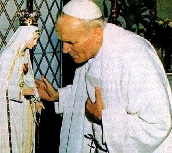UcheMaryOkoli's tweet photo. The Pope of Our Lady of Fatima

On May 13, 1981, in St. Peter's Square, exactly 64 years after the first apparition of the Virgin Mary to the three shepherd children in Fatima, Portugal; Turkish gunman Mehmet Ali Agca took aim at the Pope with a handgun (circled at left, above). 

Four bullets hit John Paul II, two of them lodging in his lower intestine, the others hitting his left hand and right arm.The bullet missed his central aorta by a few millimetres — had it not missed this, the Holy Father would have been killed instantly. The Pope, who lost nearly three-quarters of his blood and suffered shock from blood loss, underwent five hours of emergency intestinal surgery at the hospital.

While he was in the hospital, Pope John Paul reviewed the Church’s documentation of Fatima and the Third Secret of Fatima. He was convinced that Our Lady of Fatima had saved his life. Later that year, he had a mosaic of the Virgin Mary (Mater Ecclesiae — Mother of the Church) installed on St. Peter’s Square. He went three times afterwards to the shrine of Fatima in Portugal (1982, 1991 and 2000) — to thank the Virgin Mary. 

On March 25, 1984, to fulfill the request of Our Lady of Fatima, the Pope consecrated the world — including Russia — to the Immaculate Heart of Mary and Communism collapsed soon afterward.

On Dec. 27, 1983, when Pope John Paul II visited Mehmet Ali Agca, his would-be killer in jail, the man asked him: “Why didn’t you die? I know that my aim was true and I know that the bullet was very powerful and mortal.” The Pope responded: "One hand fired the shot. Another (the hand of the Virgin Mary) guided it.”

As a measure of his gratitude, John Paul gave the bullet that was extracted from his abdomen to the shrine; the bullet today forms part of the crown of the statue of the Virgin of Fatima. 

During John Paul's 2000 visit to Fatima, the third part of the message the Virgin gave to the three children in 1917 was revealed; it was a description of the assassination attempt on Pope John Paul: the “bishop clothed in white” who prays for all the faithful is the Pope. 

As he makes his way with great effort towards the Cross amid the corpses of those who were martyred (bishops, priests, men and women religious and many lay persons), he too falls to the ground, apparently dead, under a burst of gunfire.
- The Source of Miracle- Divine Mercy Miracles.