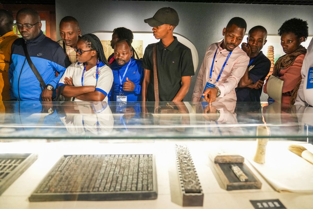 RuianChina's tweet photo. At the Chinese Wooden Movable-Type Printing Exhibition Hall in Dongyuan village, #Ruian, Burundian media professionals experienced wooden movable-type printing, opening a wordless China-Africa cultural dialogue. https://t.co/T2GjbbkG4r