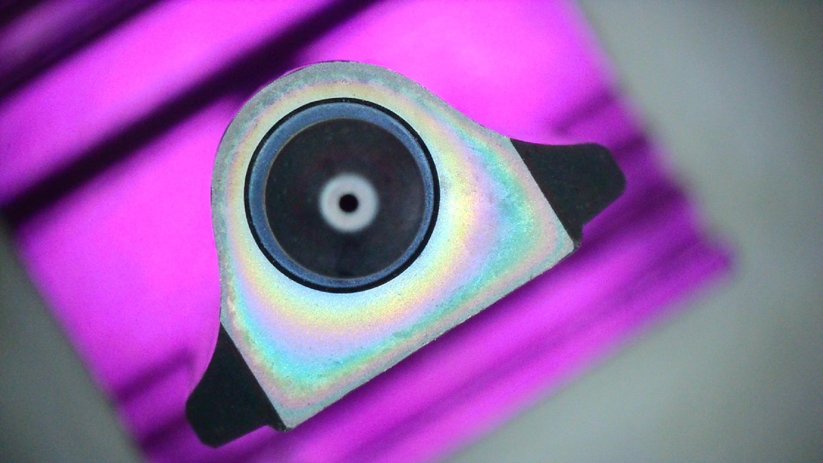E3DOnline's tweet photo. ObXiDian 500 sure does look pretty! 🤩
 
But looks aren’t everything. There’s hard science and clever engineering behind this glorious rainbow coating. 🔬
 
It’s not one homogenous structure like a coat of paint over the nozzle. Instead there’s multiple layers that are blended together, each performing a different job. 🧪
 
✅ The base layer is steel and copper
💪 Then there’s a layer of ultra-tough Chromium Nitride for extra abrasion-resistance
👌 The final layer is our unique non-stick coating which reduces nozzle blobs and increases print reliability
 
And because of the way that the coating is deposited on the nozzles the thickness of the topcoat varies slightly, and it’s this difference in thickness that we see as iridescence. 🌈
 
So now you know 🤓
 
Discover the range 👉 https://t.co/WTMb0MAYk2