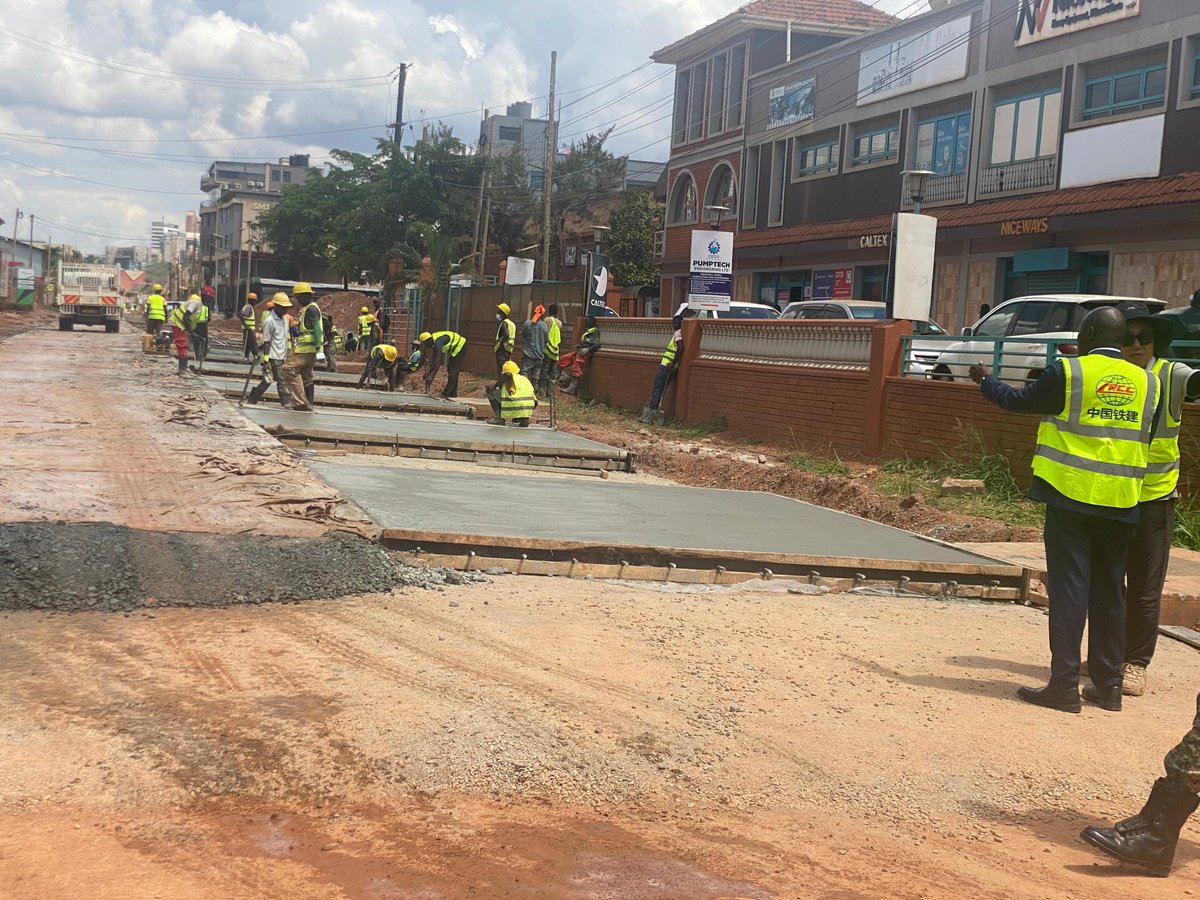 OPMUganda's tweet photo. This afternoon, the Head of the Prime Minister’s Delivery Unit, @KasuleSebunya, returned to the Industrial Area to assess progress on the ongoing road reconstruction works, which he last inspected in March. 

Due to soft ground conditions in the Industrial Area, the Government is replacing tarmac with concrete on 6th and 7th Streets.

Mr. Sebunya was pleased to note that 6th Street is complete and open to the public, while works on 7th Street are progressing well. He also inspected reconstruction works on 5th and 8th Streets.