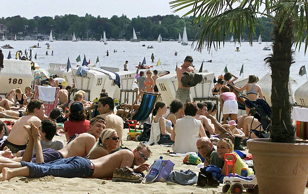 25YearsAgoLive's tweet photo. A crowded beach on Berlin’s Strandbad Wannsee.

Berliners who lack the means or motivation to go to the sea can find their very own lake in the west of the city, which gets crowded on hot spring days like this. https://t.co/svjv2BIABS