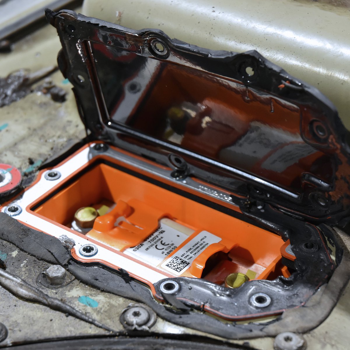 revoltaris's tweet photo. The HV fuse in older Tesla batteries has an expiration date. When the car says "replace HV fuse", it means it. We swap them with original parts. Find us in Zurich, Switzerland. https://t.co/RLM05ULW0E