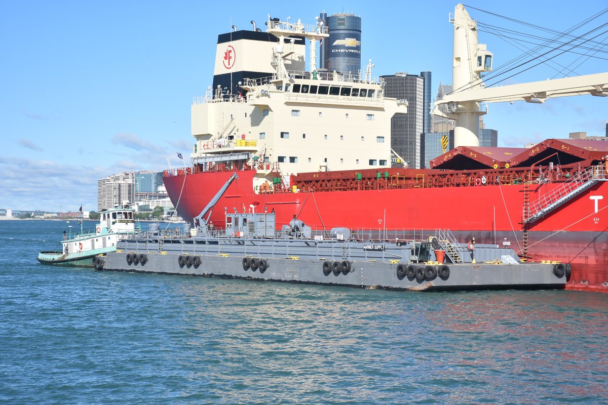SailDiamondJack's tweet photo. A freighter holds steady while a Warner Supply barge eases alongside. Off to the side, the Gaelic Tugboat nudges everything into place. Captured by Captain Mike Nicholls… a moment of the river doing what it’s always done working. https://t.co/q9UDEt5kIn