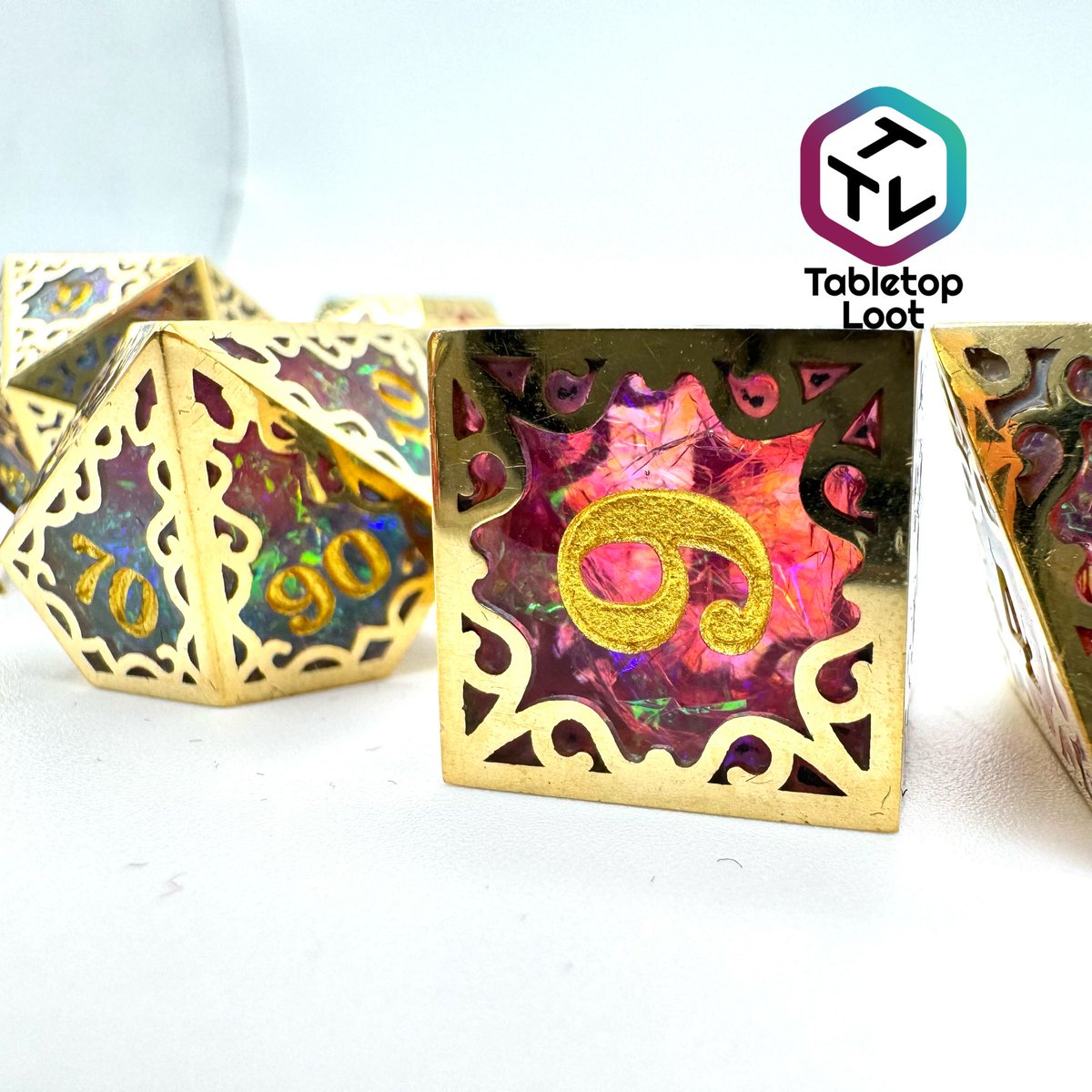 TabletopLoot's tweet photo. These incredibly unique dice are pique craftsmanship!! Starting with a stunning iridescent foil resin dice interior and then framing that dice in a cut metal filigree frame! Super limited so get a set while you can!! https://t.co/UzzCcfBaAH