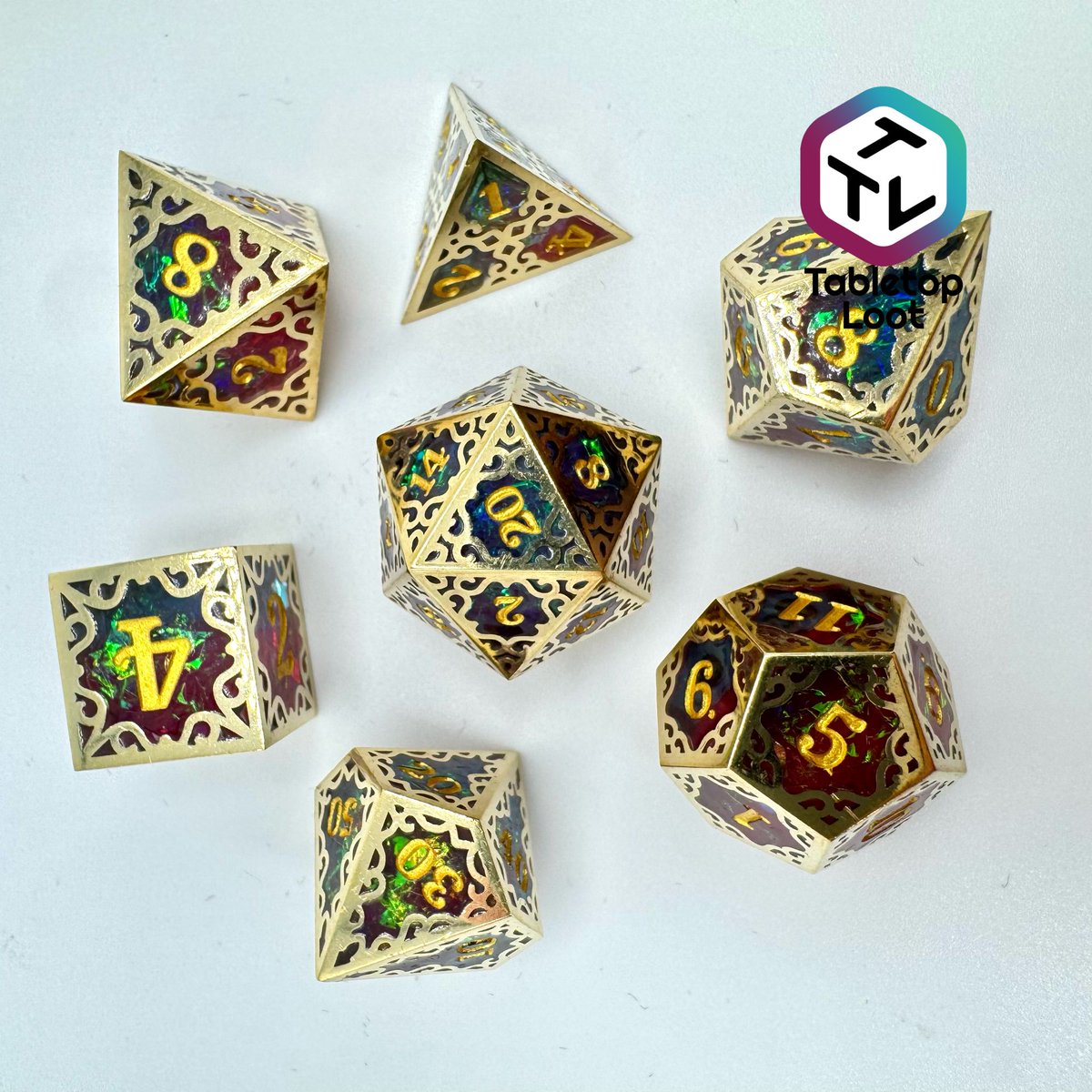 TabletopLoot's tweet photo. These incredibly unique dice are pique craftsmanship!! Starting with a stunning iridescent foil resin dice interior and then framing that dice in a cut metal filigree frame! Super limited so get a set while you can!! https://t.co/UzzCcfBaAH