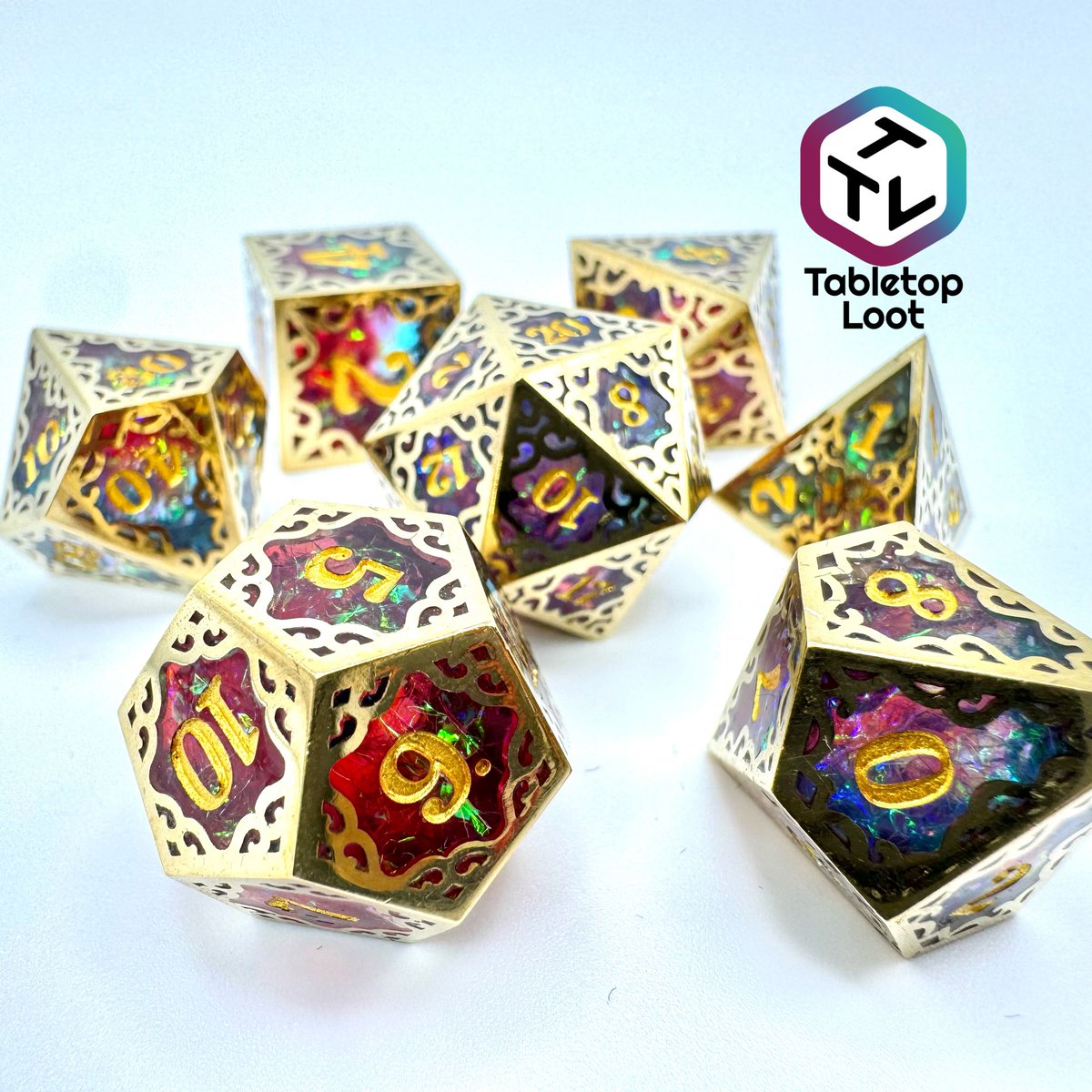 TabletopLoot's tweet photo. These incredibly unique dice are pique craftsmanship!! Starting with a stunning iridescent foil resin dice interior and then framing that dice in a cut metal filigree frame! Super limited so get a set while you can!! https://t.co/UzzCcfBaAH