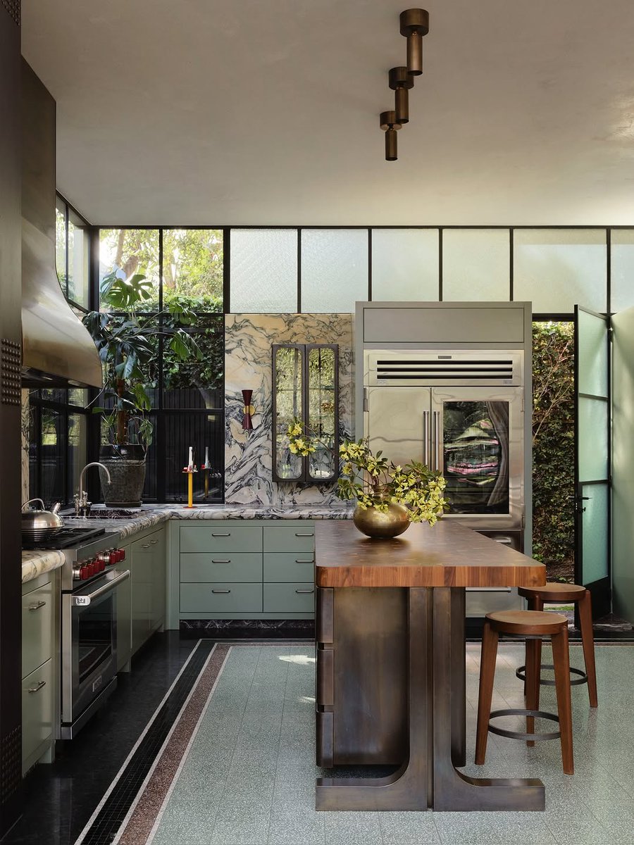 flackstudio_'s tweet photo. Dramatic Breccia Capraia marble splashback, aged brass rangehood, hand-painted cabinetry, and Sub-Zero Wolf appliances stand as sculptural elements in Domain's kitchen.

Anchoring the double-height contemporary addition where translucent glass brick ... https://t.co/nuH1legodL