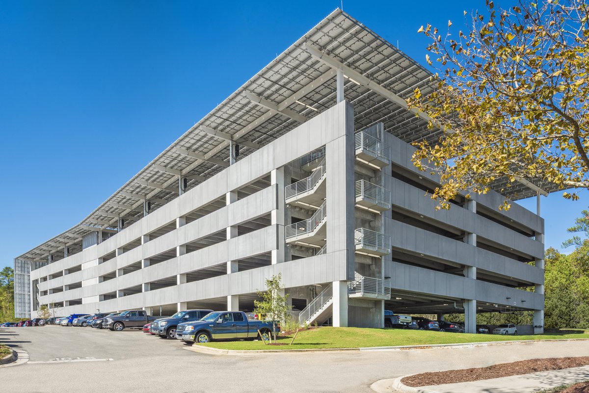 GCPCI's tweet photo. The Lenovo Parking Garage design team replaced metal panels with a precast concrete solution as an architectural feature to help the structure reflect the verdant setting of the 67-acre campus it was located on. View the full project profile at https://t.co/zCYkaheGYB https://t.co/LGhyl2WuMz