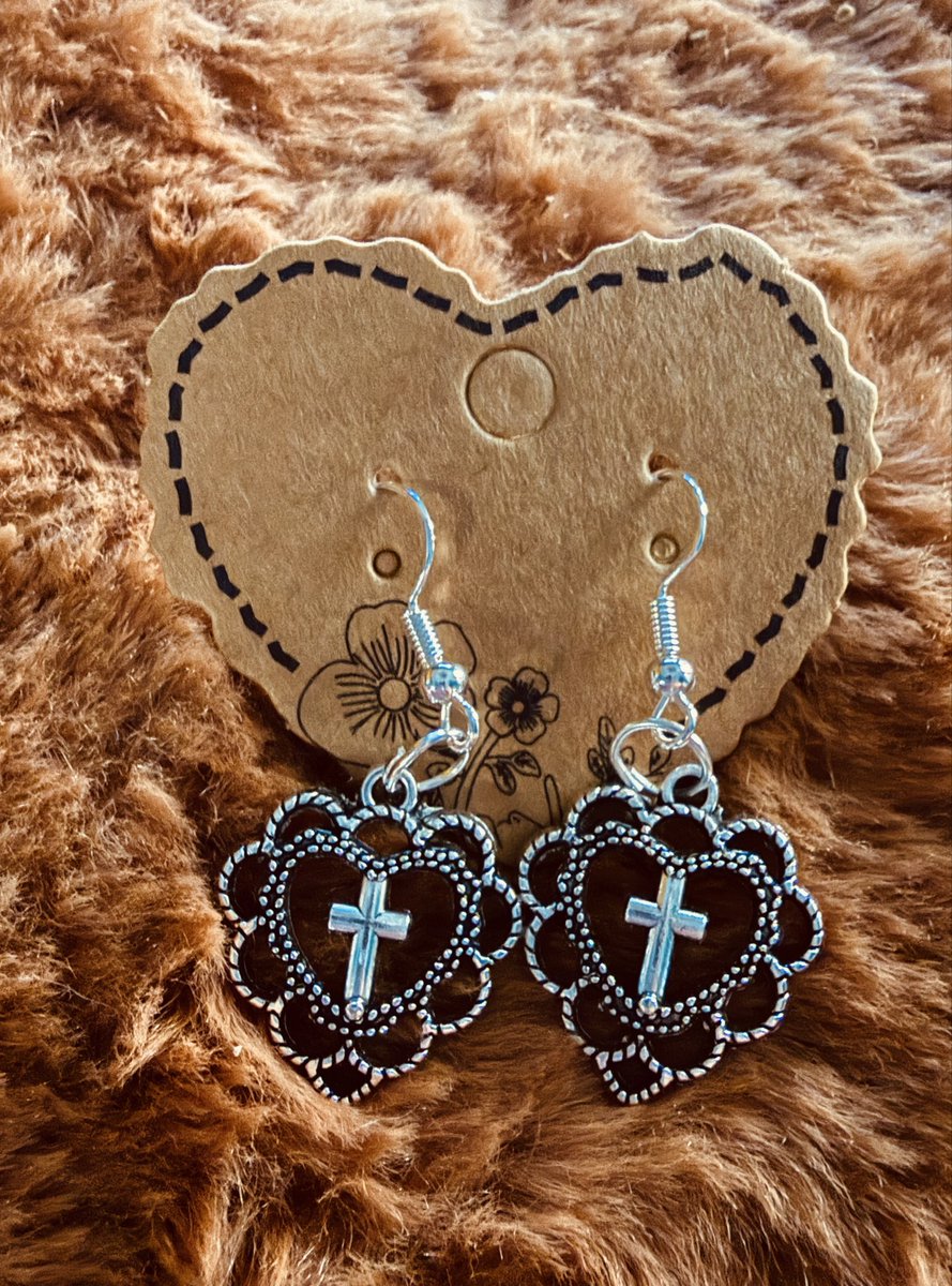 Jordan318J's tweet photo. My Best Selling heart cross earrings have been restocked. Each pair is priced at $10 and features nickel-free earring hoops. You may place an order by messaging me, emailing jeanette@creationsoftheheartart.com, or calling 574-213-5176 and leaving a message. https://t.co/bMJok7CbGO