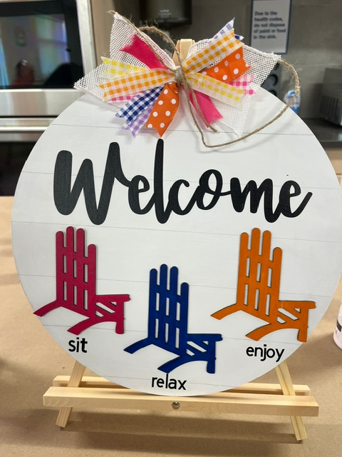 HHHCL's tweet photo. We're excited to share this photo from a recent craft class, where our talented adults created a cheerful welcome sign featuring classic Adirondack chairs and the reminder we all need: "Sit. Relax. Enjoy."

Find all upcoming adult craft classes at https://t.co/XqsL0jyxn6. https://t.co/xsafOC0tVn