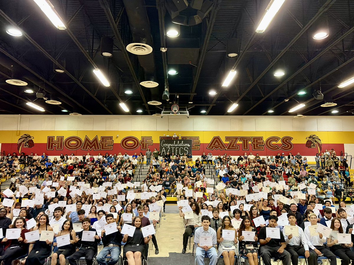 MrJacobRamirez's tweet photo. One final round of accolades for the Class of 2026. ❤️🖤💛 Looking out at this gym full of future leaders, creators, athletes, and dreamers is so special. Every certificate represents hard work, resilience, growth, and countless hours of dedication. So proud of our Aztecs! https://t.co/yX2xtWnYD5
