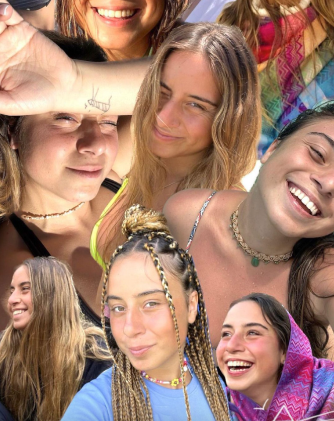 Mazelit_'s tweet photo. Shir Georgy (22) was murdered on October 7 by Hamas terrorists at the Supernova music festival. 

She was last seen in a short video from that Saturday morning huddling in a small shelter with a police officer and other partygoers, one of whom appeared to have been shot in the leg. 

Her family clung to the video as hope she had managed to escape, but after a week of searching, they were informed on October 14, 2023 that her body had been identified. 

Her friends remembered Shir as someone who loved traveling, was a surfing fanatic, and could always be found on the dance floor. 

She had a sun tattooed just behind her ear, because “she always wanted to radiate light,” according to a memorial Instagram page set up for her.

Shir Georgy was one of 1,200 Jews killed in the Palestinians' terror attack on the country that day. She was only 22.