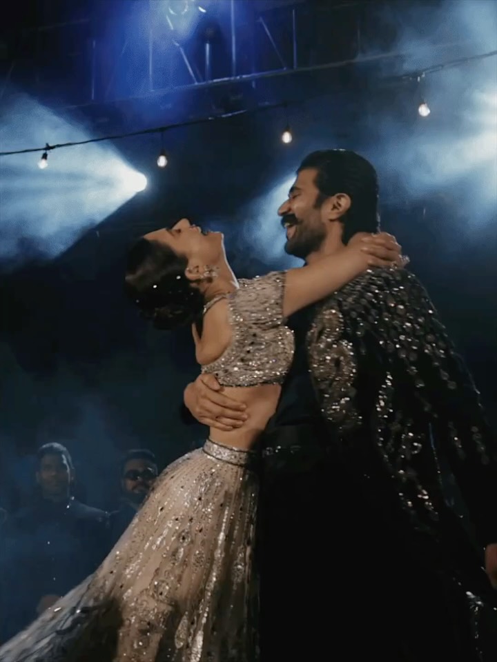 stylebyami's tweet photo. Reliving this sangeet in my head and smiling to myself. It was so personal and sooooo them 💙🤍

Vijay in that navy dragon-embellished velvet open jacket, the open-neck silk shirt, the layered stole, the cummerbund, the shoes, all tonal. And that regal... https://t.co/7T0vbRths0